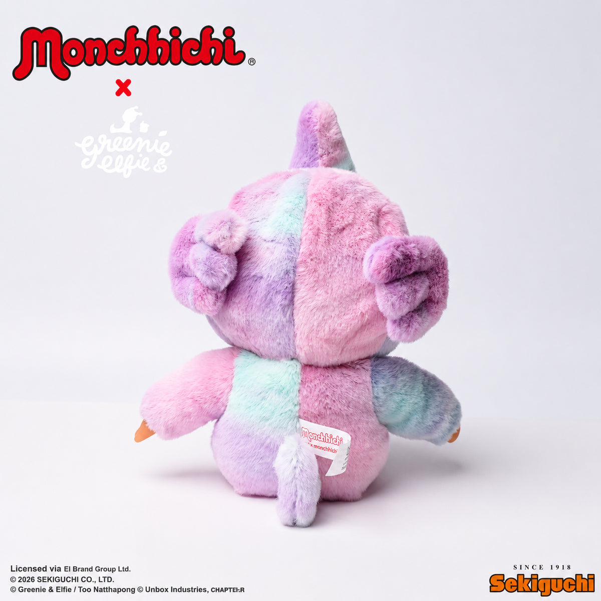 Monchhichi and Greenie plush dolls on white background