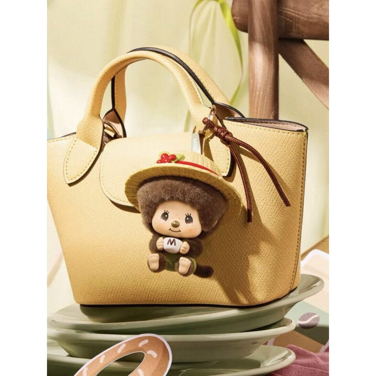Monchhichi Mon Mon Farm Classic Coffee plush charm clipped on a handbag
