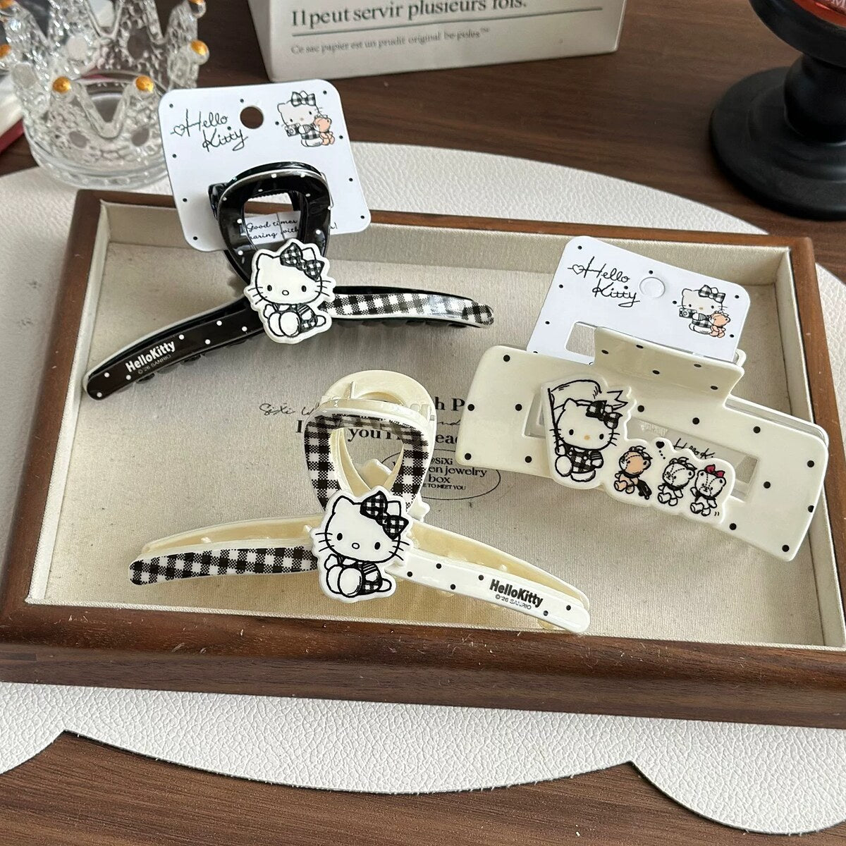 Hello Kitty claw clip collection on display tray with official Sanrio tags