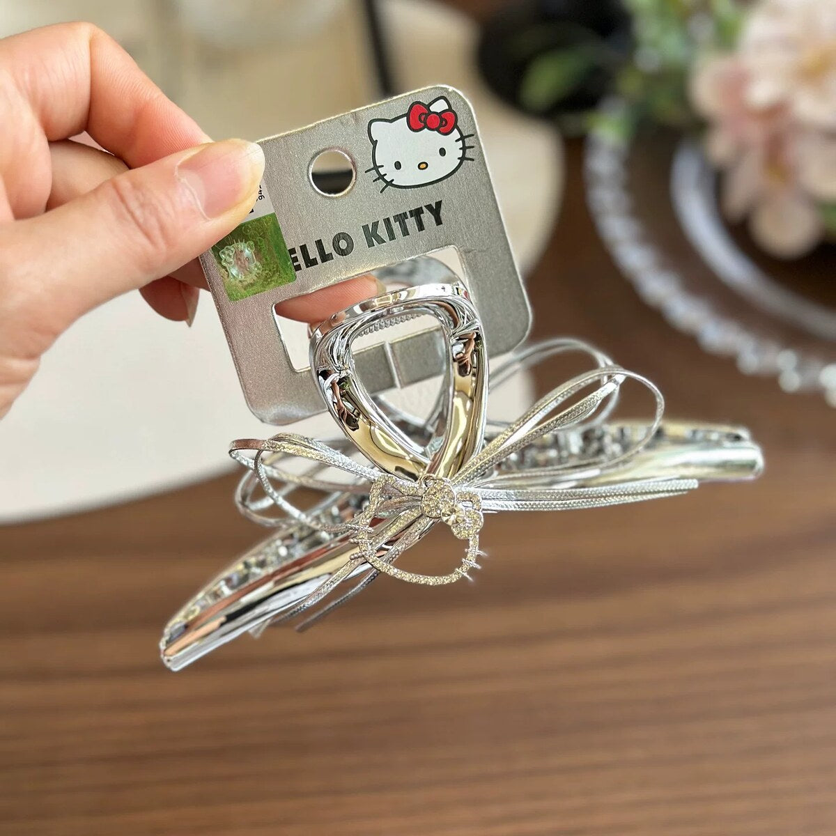 Hello Kitty licensed silver bow shark clip on licensed card