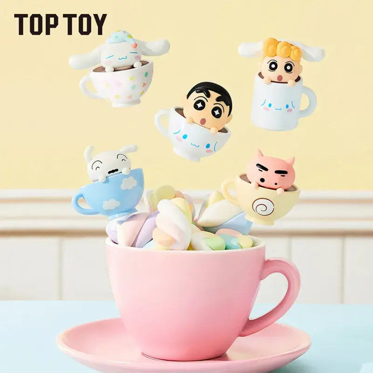 Crayon Shin-chan and Cinnamoroll mini figures floating above a pink teacup