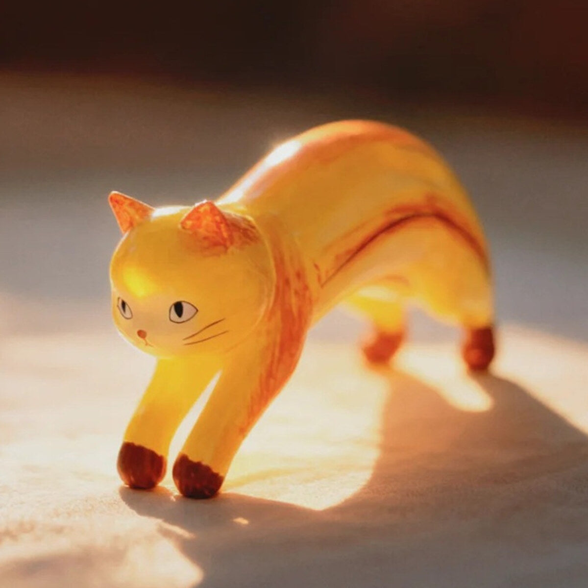 Banana Cat figure arching like a ripe banana from the 52TOYS x COMUGI Fruit Cat Series