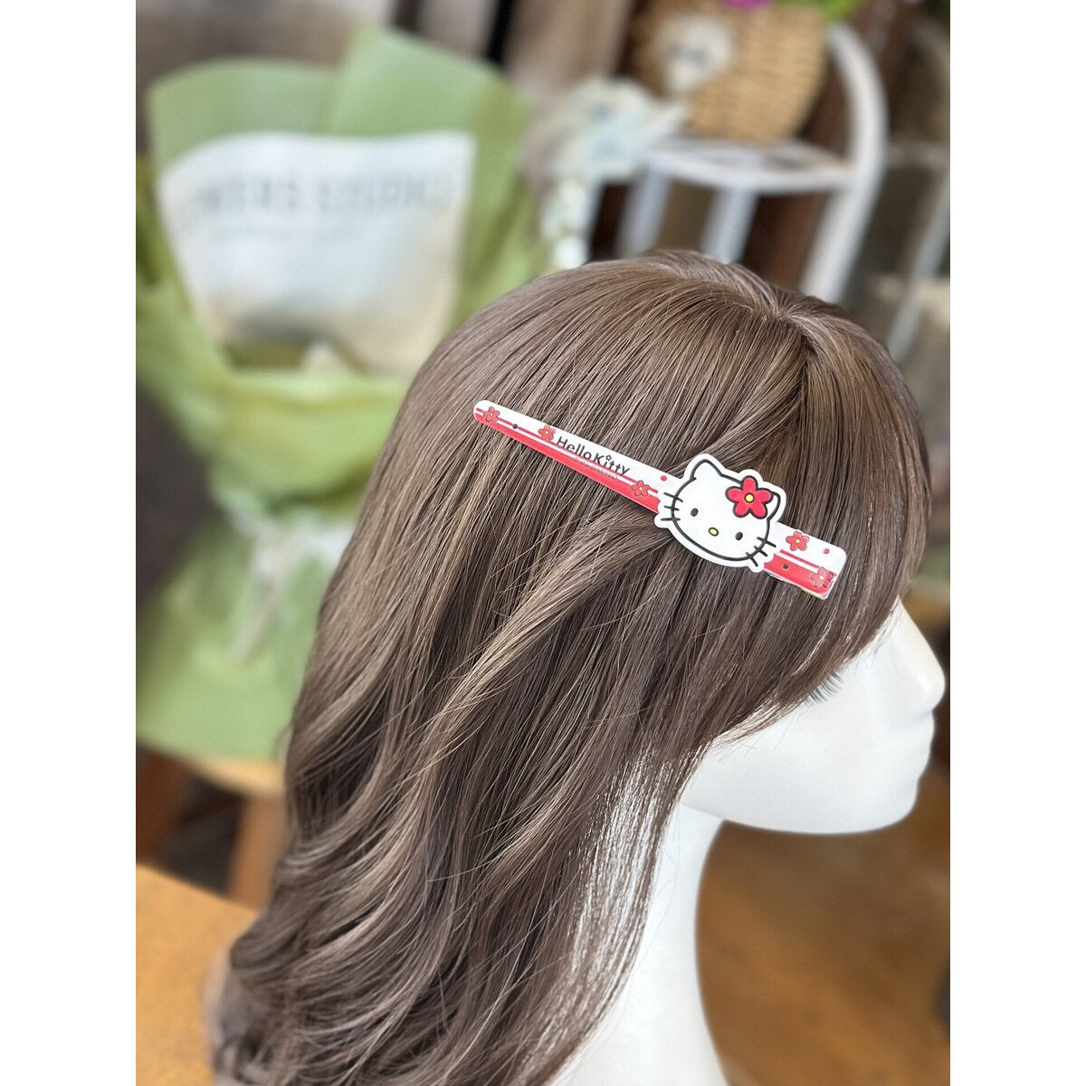 Sanrio Hello Kitty striped long bar hair clip worn in hair