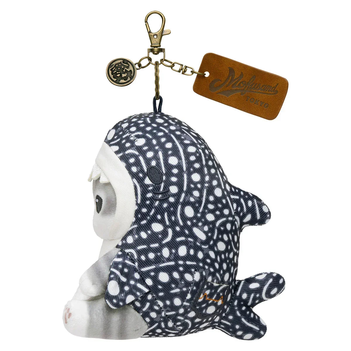 Side view of a Mofusand gray cat plush keychain in a black and white patterned shark costume