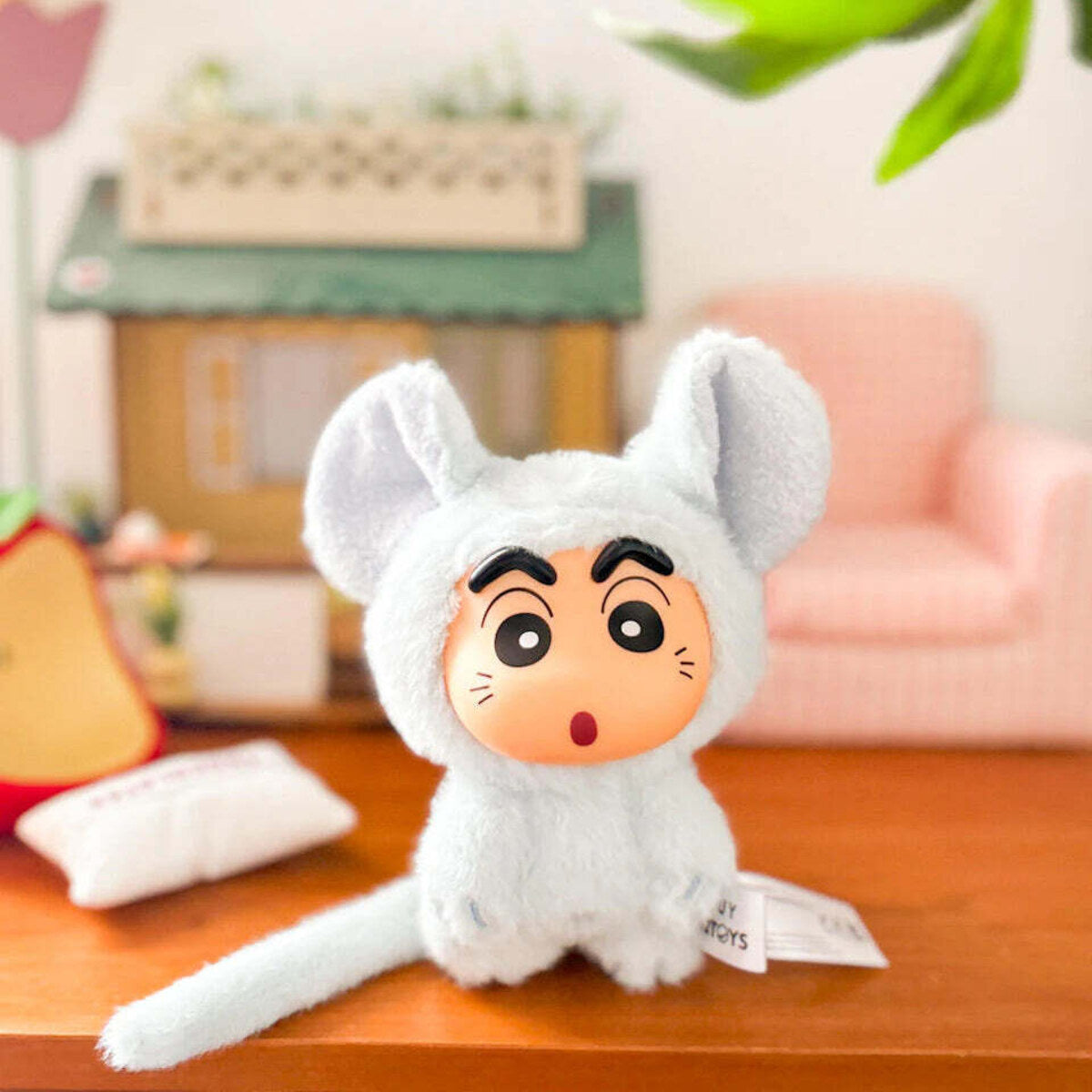 Silly Bunny plush charm hanging under a red umbrella