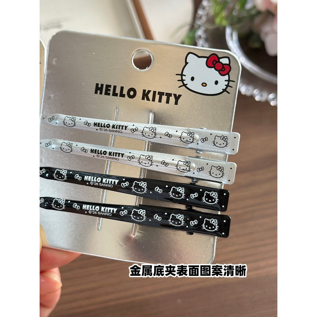 Hello Kitty silver and black no-crease hair clips on official Hello Kitty backing card