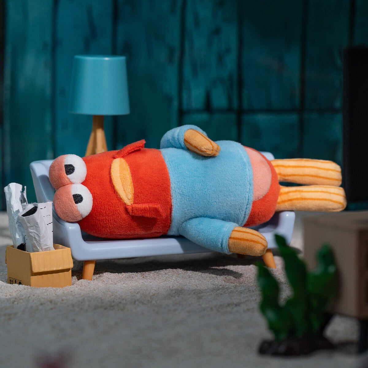 POP MART SpongeBob SquarePants Bikini Bottom Buddies Whimsical Plush - Limp Fish design lying flat on a couch