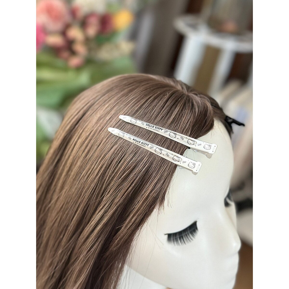 Hello Kitty one-word hair clips holding bangs in place - genuine licensed clip set