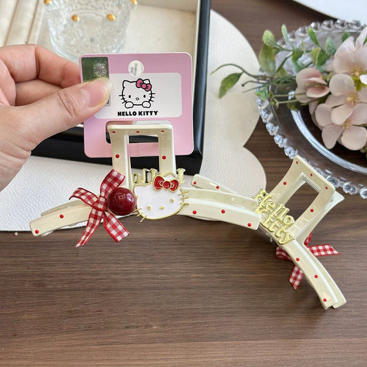 Hello Kitty red polka dot cream claw clip with gingham bow, cherry bead and gold Kitty charm on official brand card