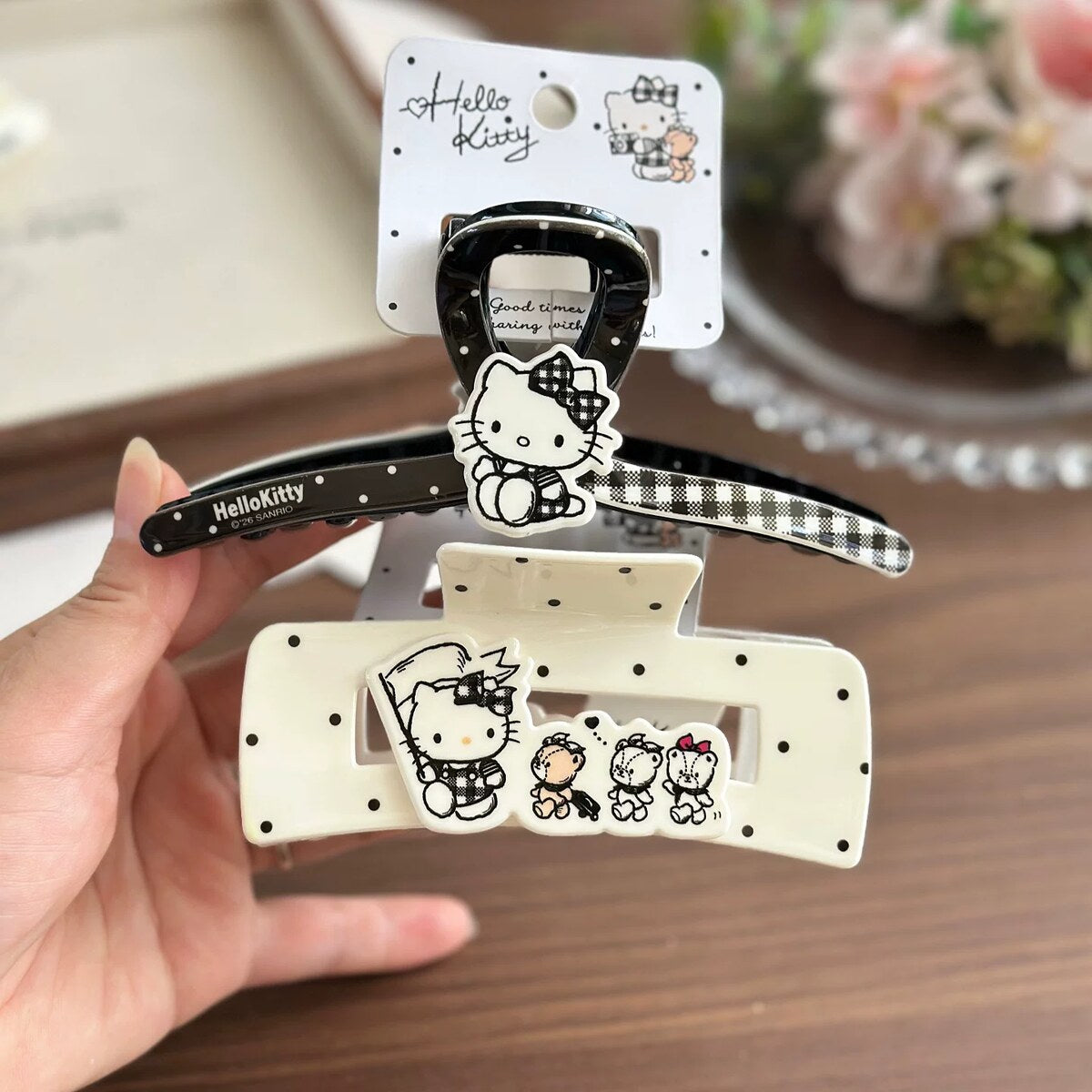 Licensed Hello Kitty black and ivory claw clips with branded tag, Kitty and friends charm