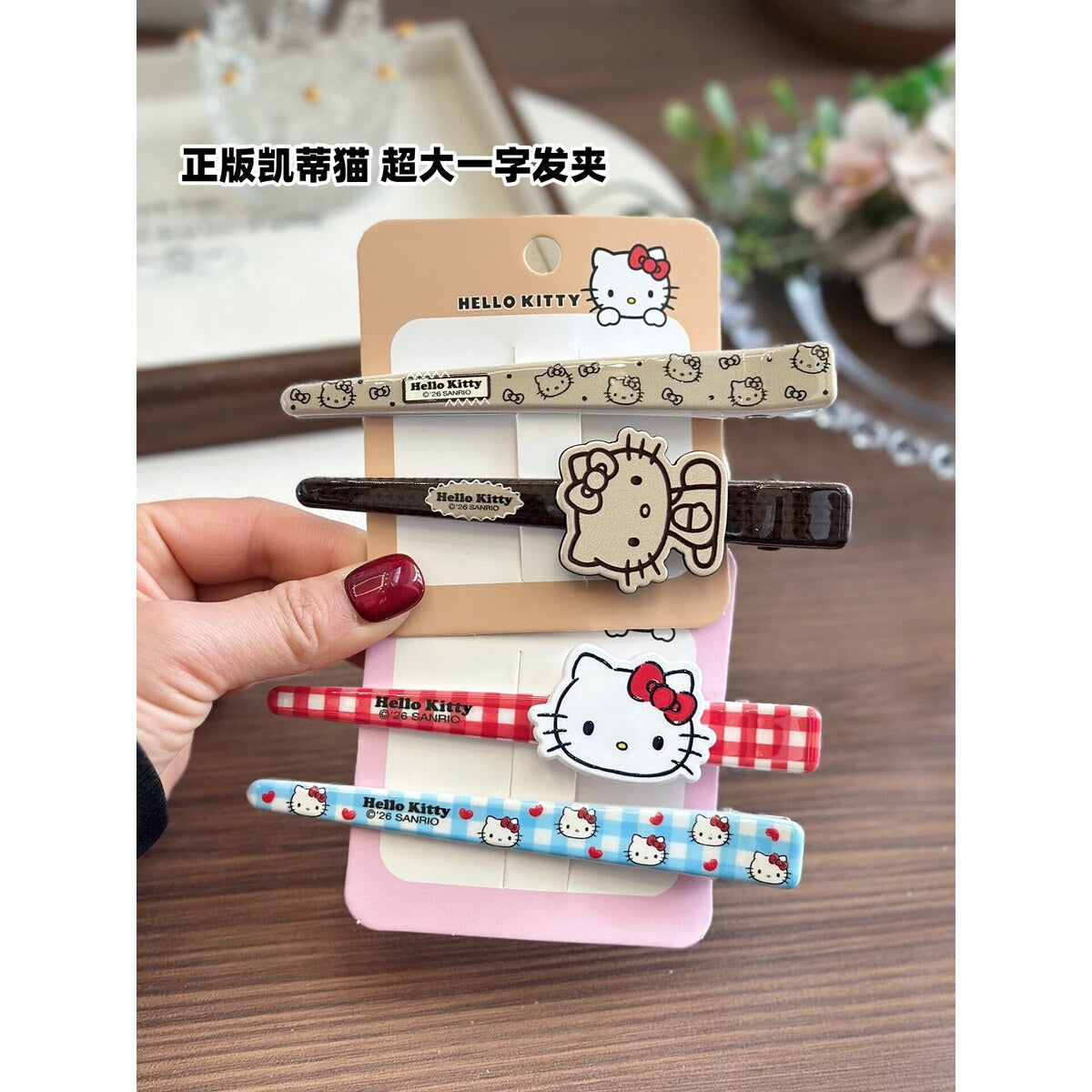 Genuine Sanrio Hello Kitty extra large bar hair clips in five designs on Hello Kitty backing cards with anti-counterfeit label