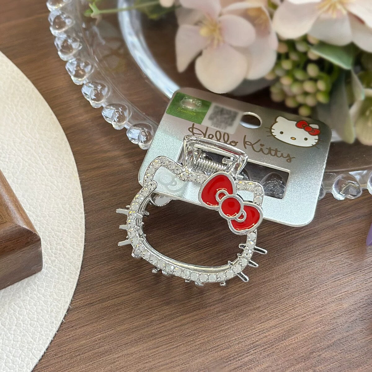 Hello Kitty rhinestone metal claw clip in silver tone with red bow on official brand card