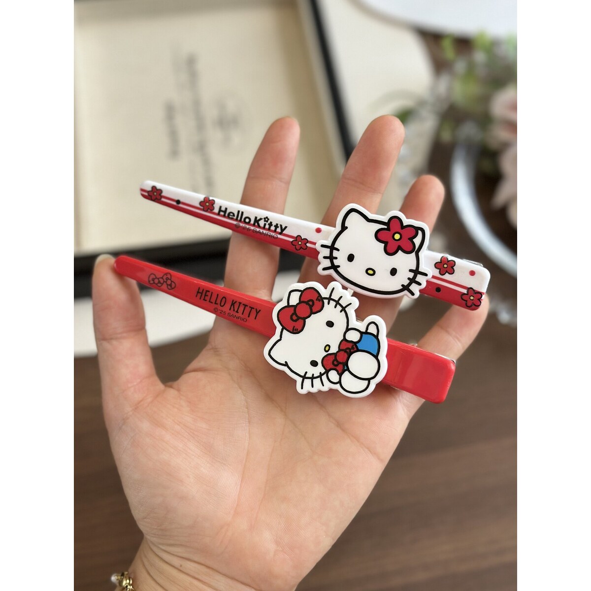 Sanrio Hello Kitty long bar hair clips in hand - genuine licensed hair accessories