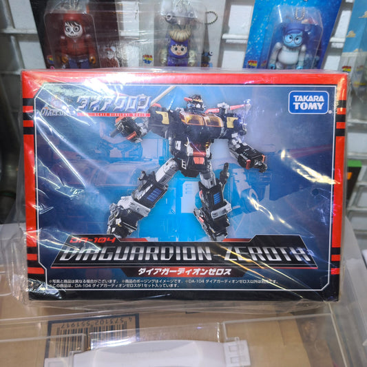 Front panel of the Takara Tomy Diaclone DA-104 packaging box showing a dynamic action shot of the assembled black and silver Diaguardion-Zeroth mecha over a blue glowing background.