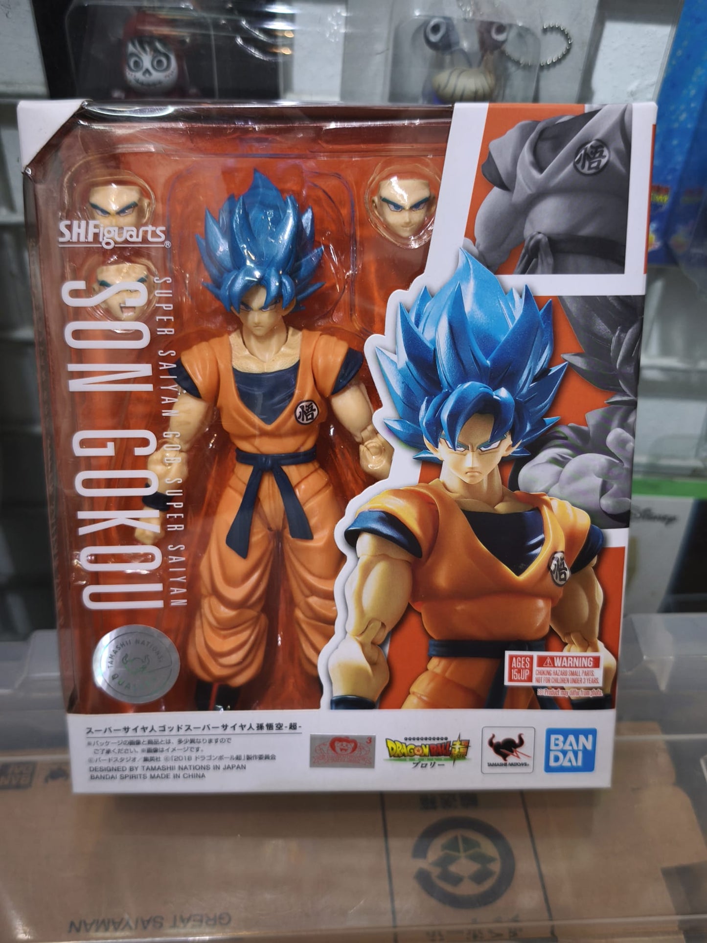 Front window box packaging of the Bandai S.H.Figuarts Super Saiyan God Super Saiyan Son Goku -Super- action figure with an official Toei Animation sticker.