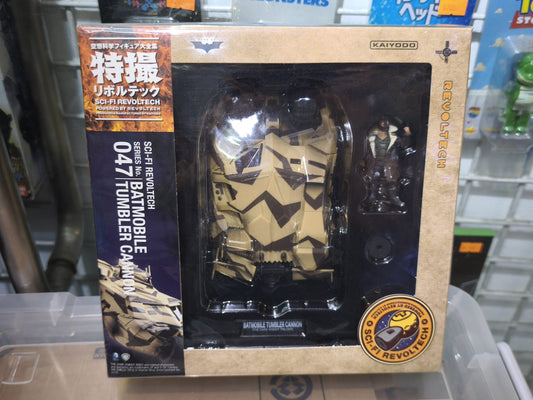 Front window box packaging of the Kaiyodo Sci-Fi Revoltech No. 047 Camouflage Batmobile Tumbler Cannon Version with official Dark Knight Trilogy branding.