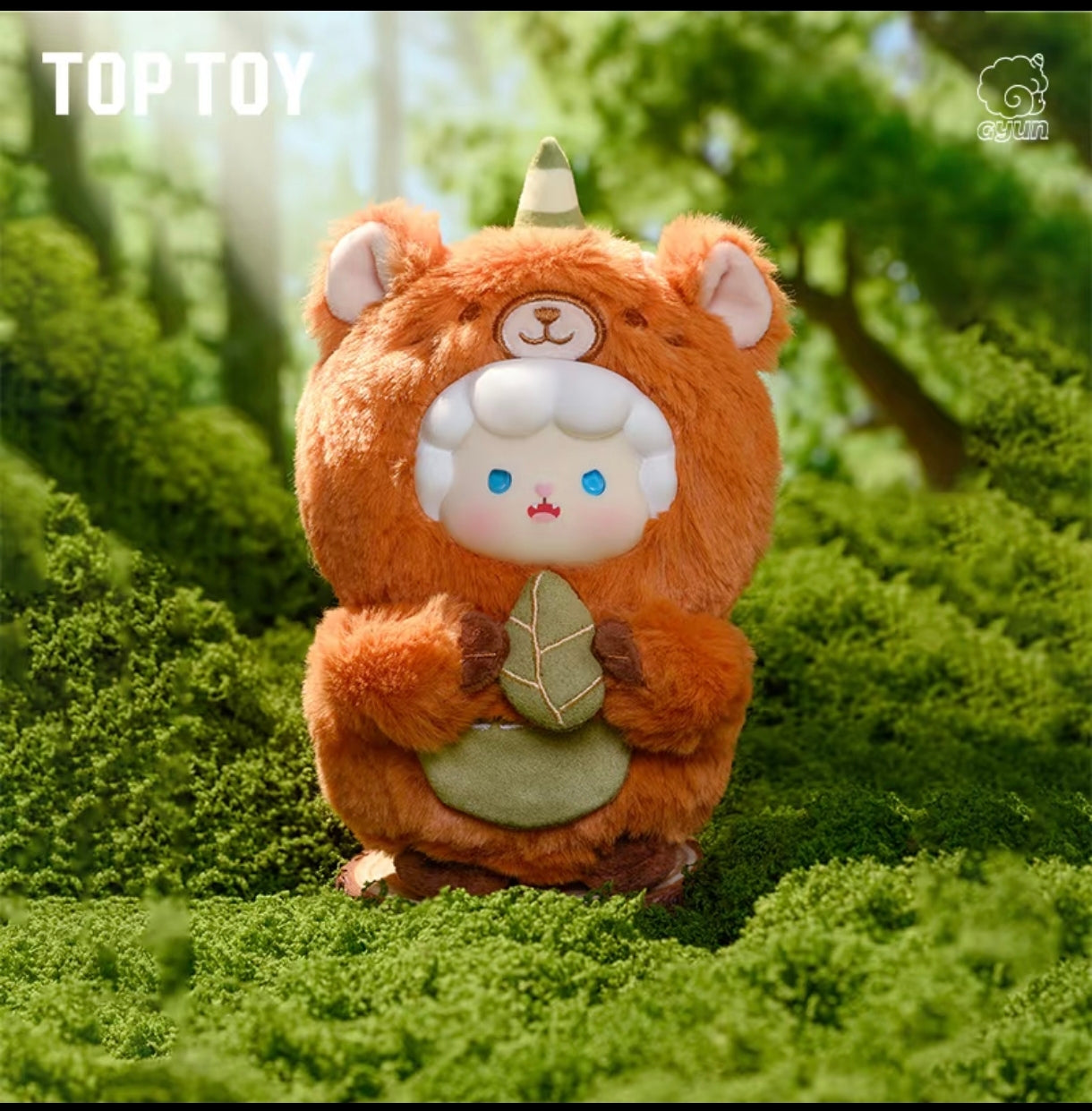 Gyun Big-Tailed Critter Crew plush figure wearing an orange bear hood costume and holding a green embroidered plush leaf.