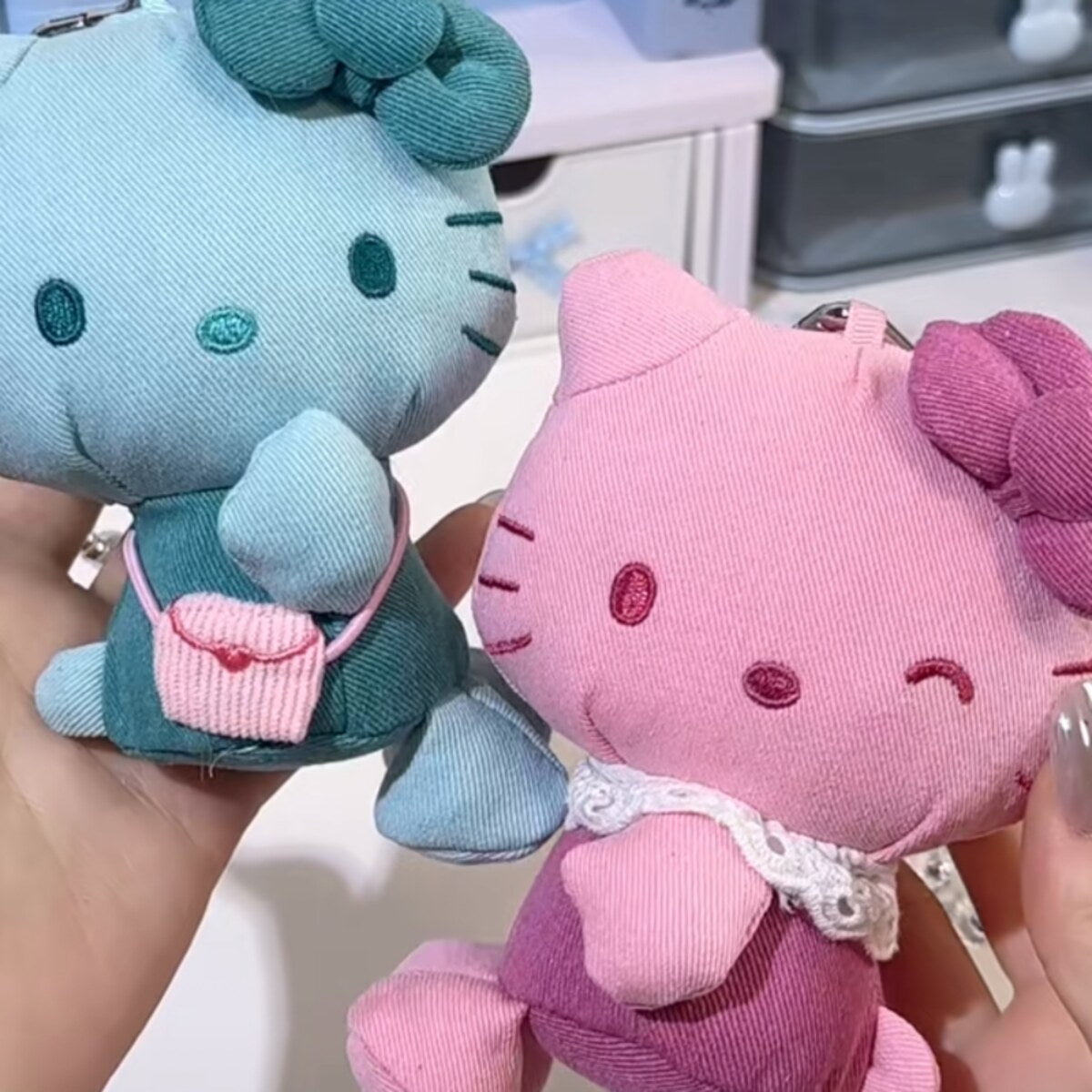 Held Hello Kitty denim series plush charms in mint green with pink bag and magenta pink