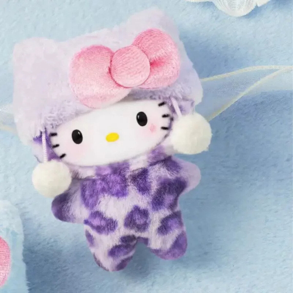 Hello Kitty Leopard Series Fluffy Taro plush charm on blue background