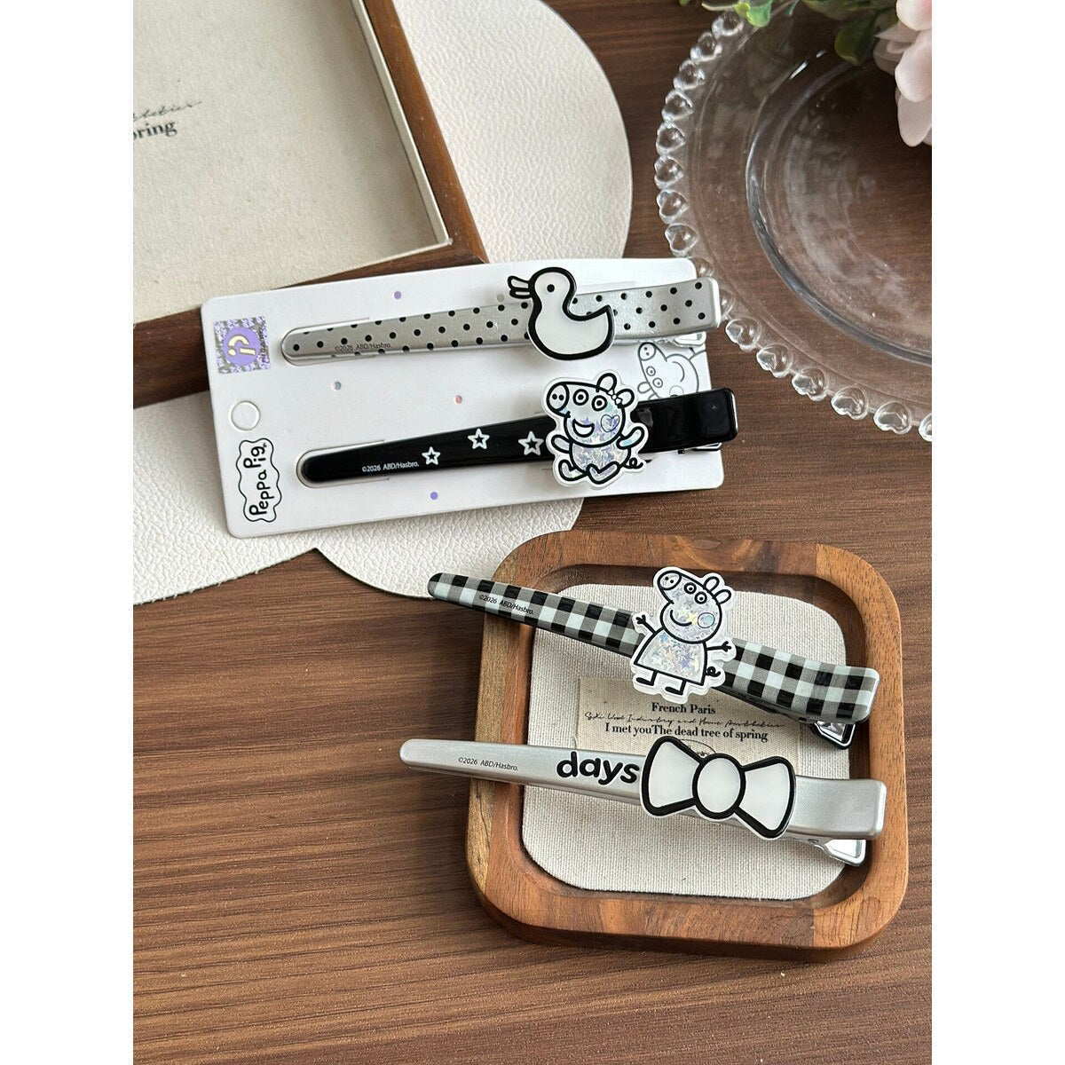 Peppa Pig days bow and George star bar clips styled on tray