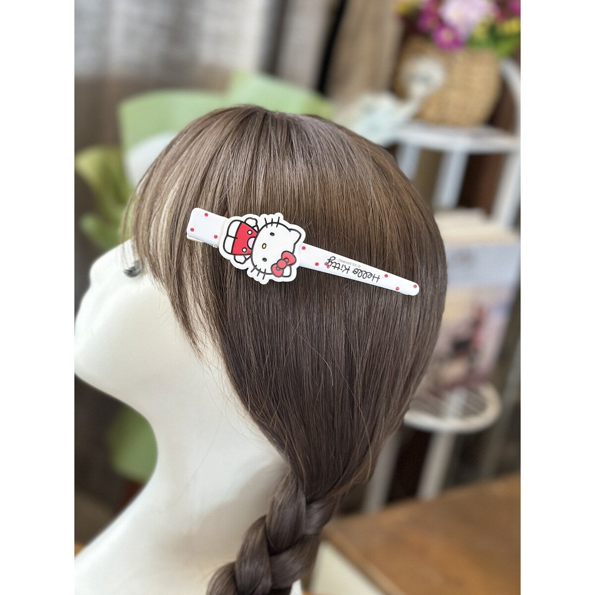 Sanrio Hello Kitty bar hair clip styled on model - side hair clip