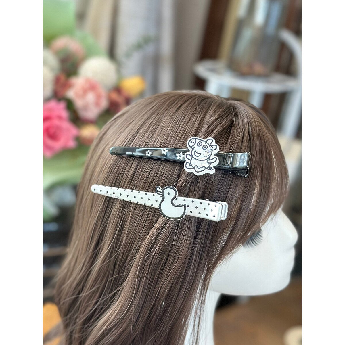 Girl wearing Peppa Pig polka dot duck bar clip