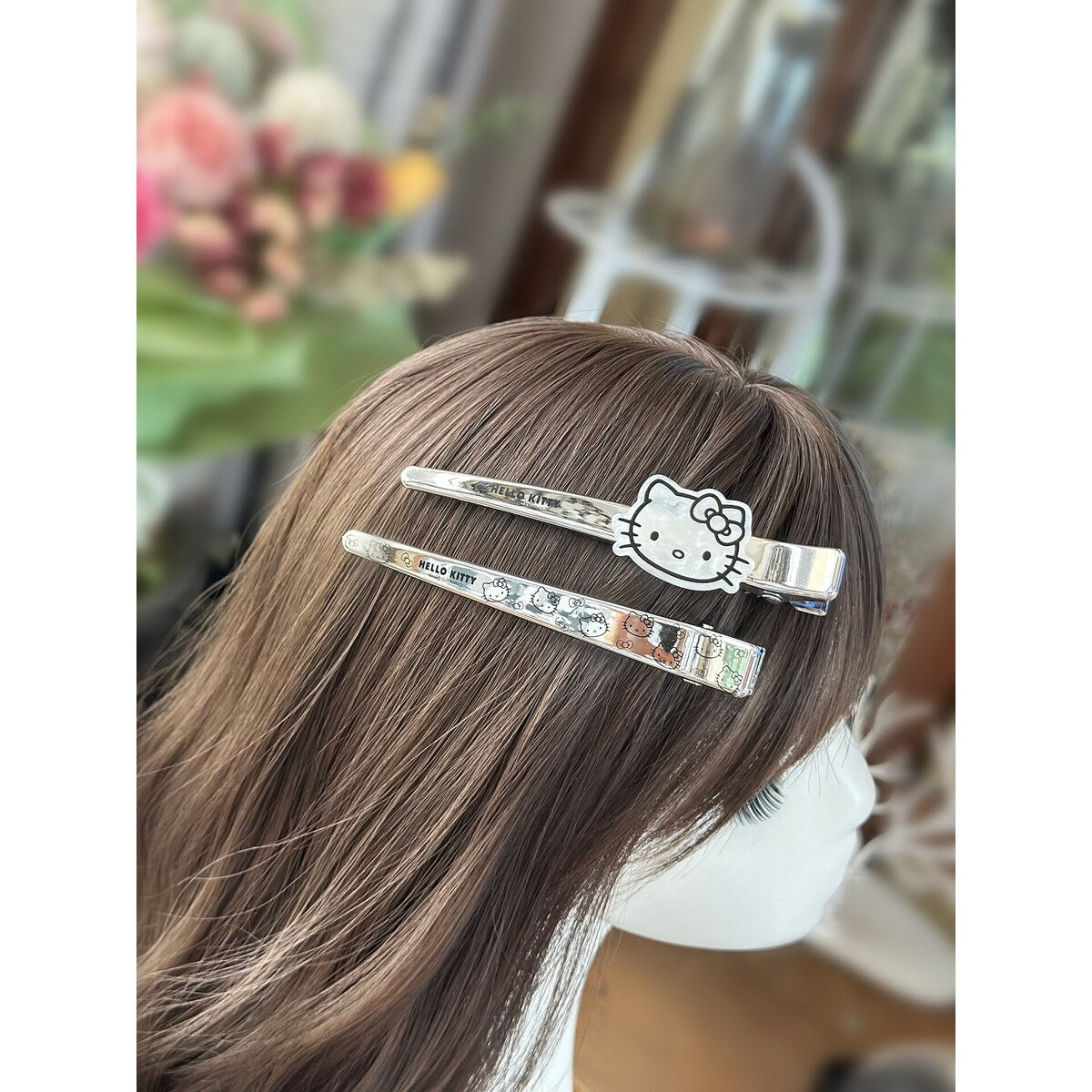 Hello Kitty silver extra large bar clip worn in hair holding back bangs and side hair