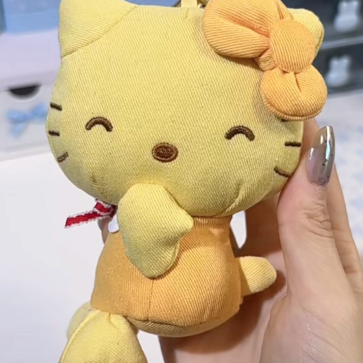 Hello Kitty denim series plush charm in yellow corduroy with yellow bow